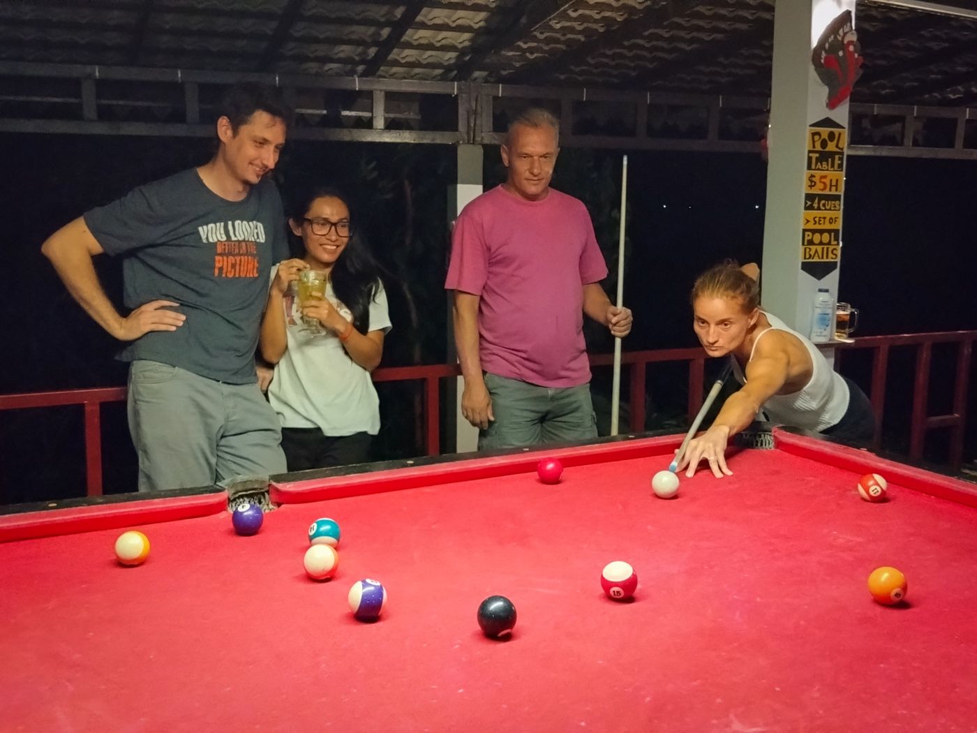 Guests playing billiards in the evening